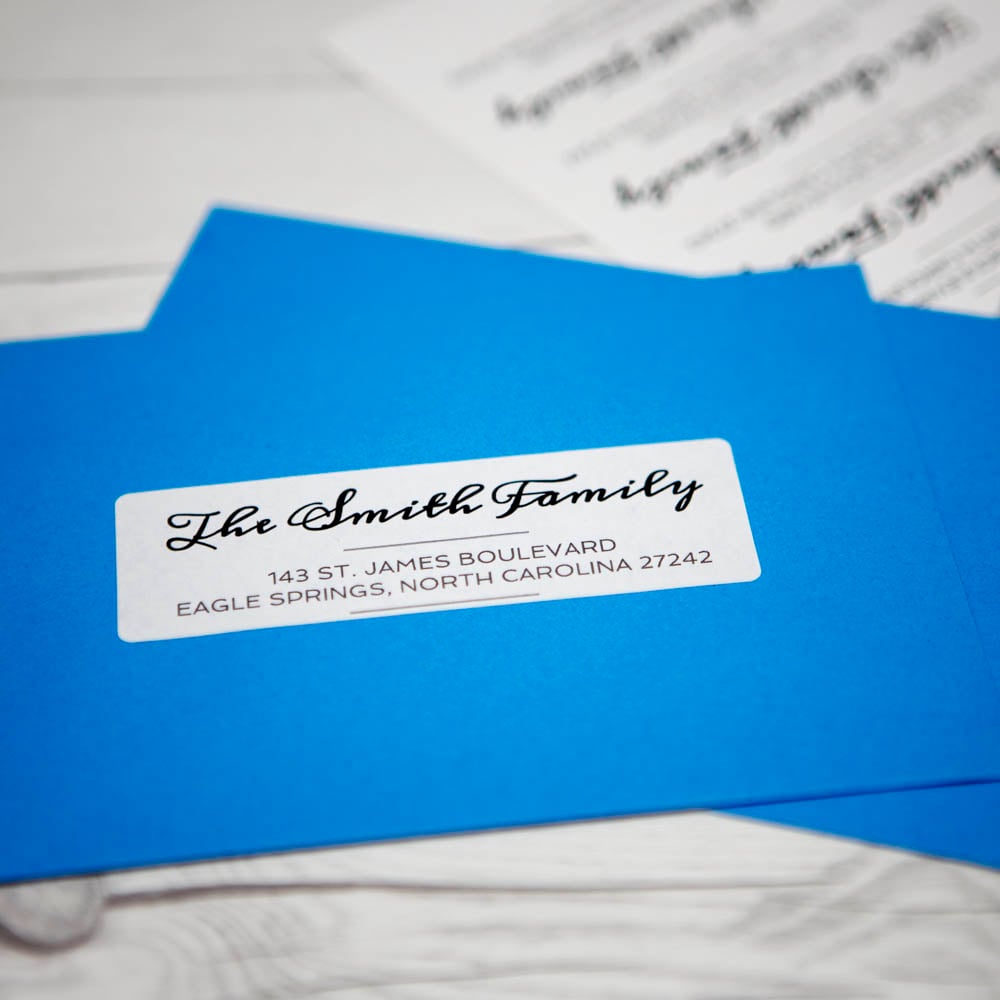 4" x 1.33" white matte address label used on bright blue mailing envelope