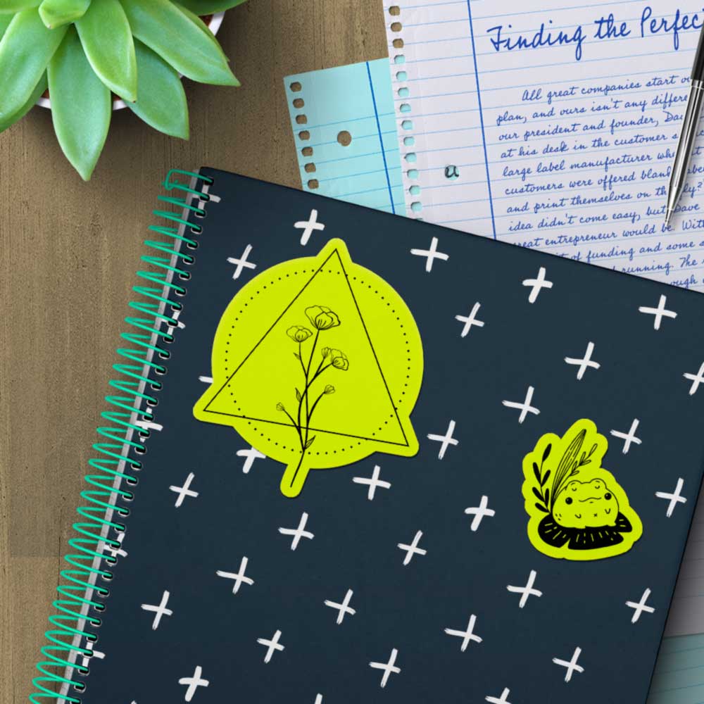 Fluorescent yellow stickers on a notebook.