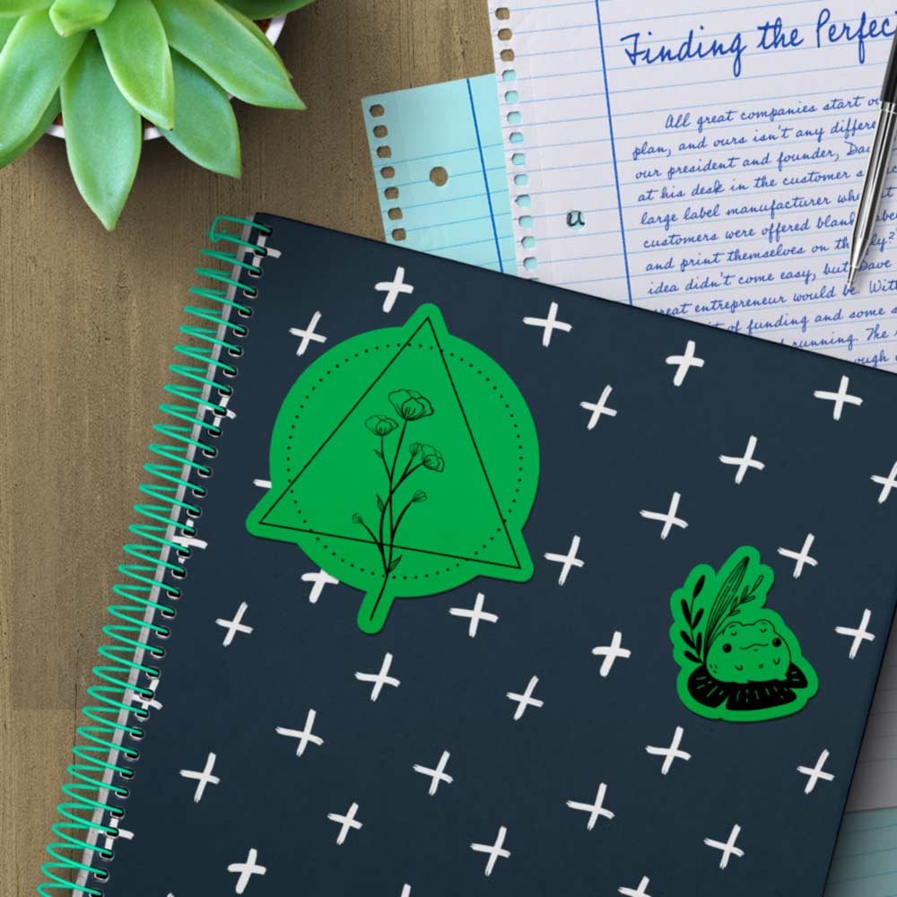 True green stickers on a notebook.