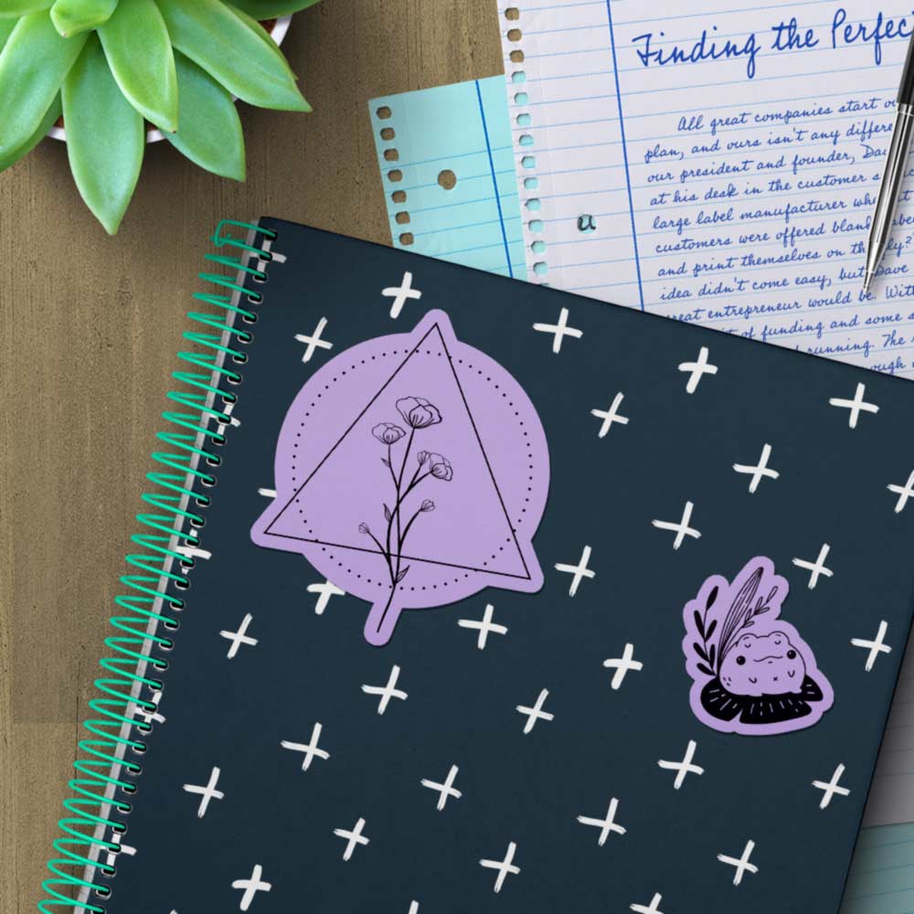 True purple stickers on a notebook.