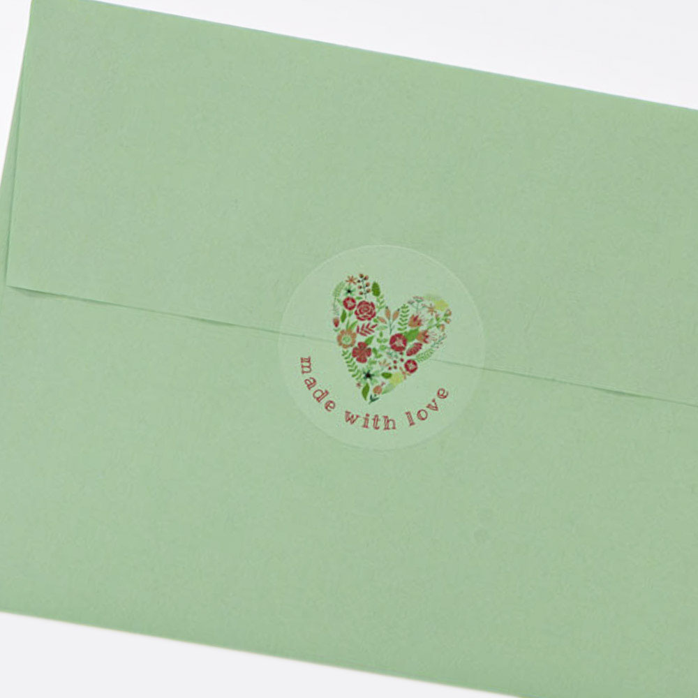 1.67" circle label on clear matte laser applied to green envelope as envelope seal