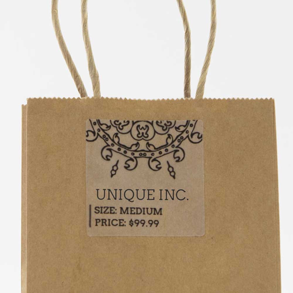 2" x 2" square label on clear matte laser used on brown kraft shopping bag