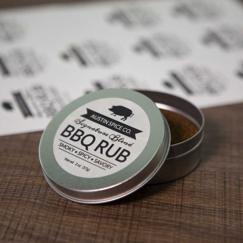 2.5" clear matte BBQ rub product label on small round tin lid