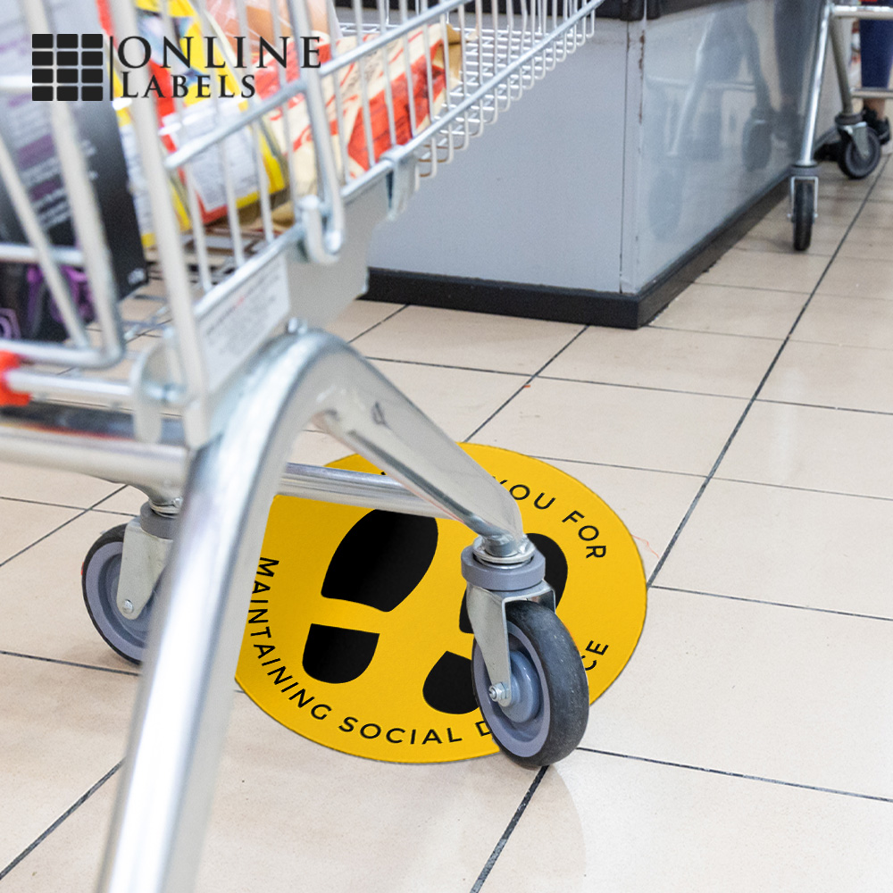 Social distancing floor decal in grocery store checkout line