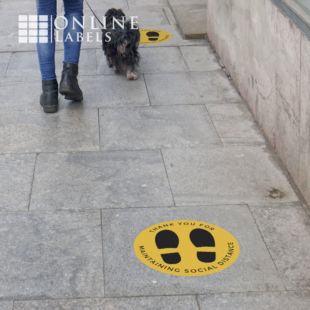 Social distancing floor decal on sidewalk