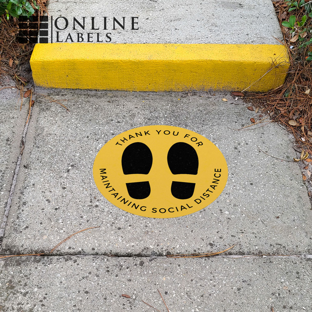Social distancing decal in front of outdoor walkway/steps