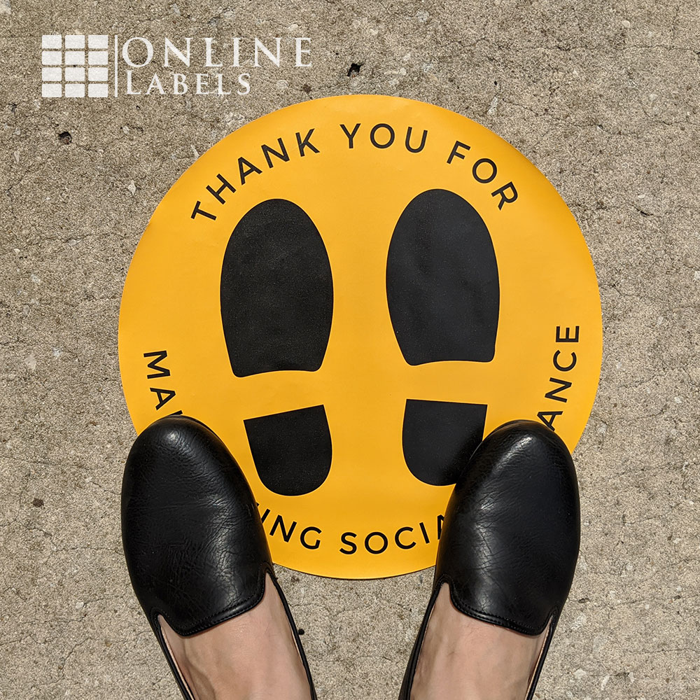 Feet on social distancing floor decal