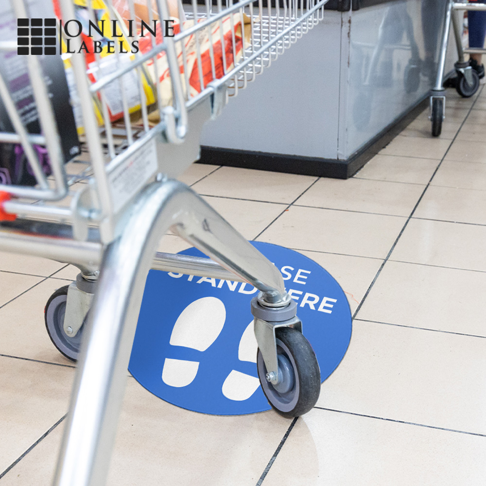 Social distancing floor decal in grocery store checkout line