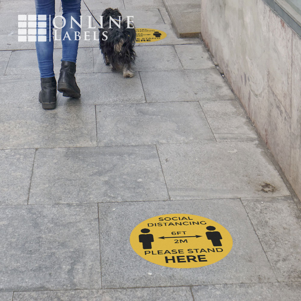 Social distancing floor decal on sidewalk