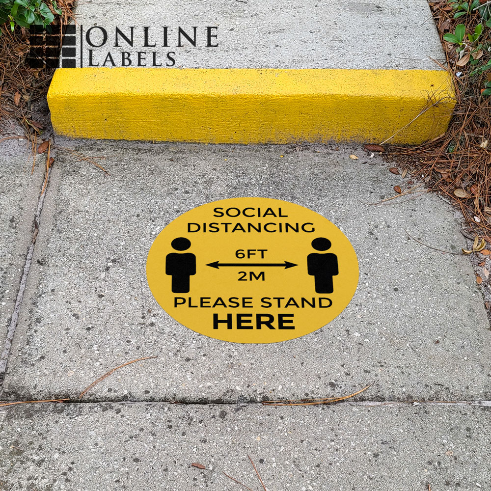 Social distancing decal in front of outdoor walkway/steps