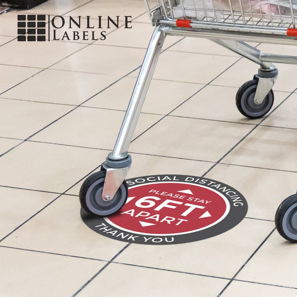 Grocery cart rolling over indoor social distancing floor sticker, 6 ft apart