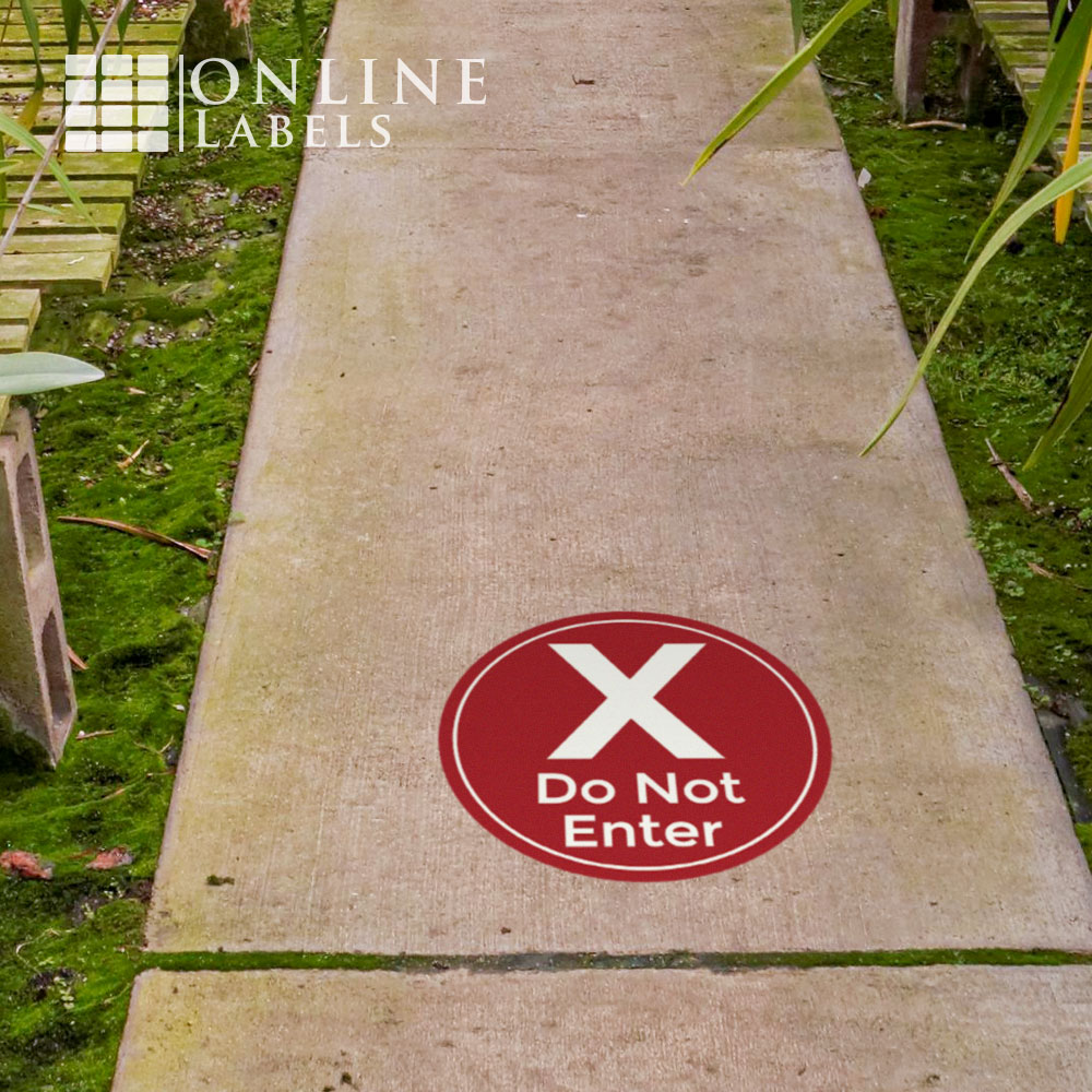 Red "do not enter" sticker on sidewalk to help customers practice social distancing during covid