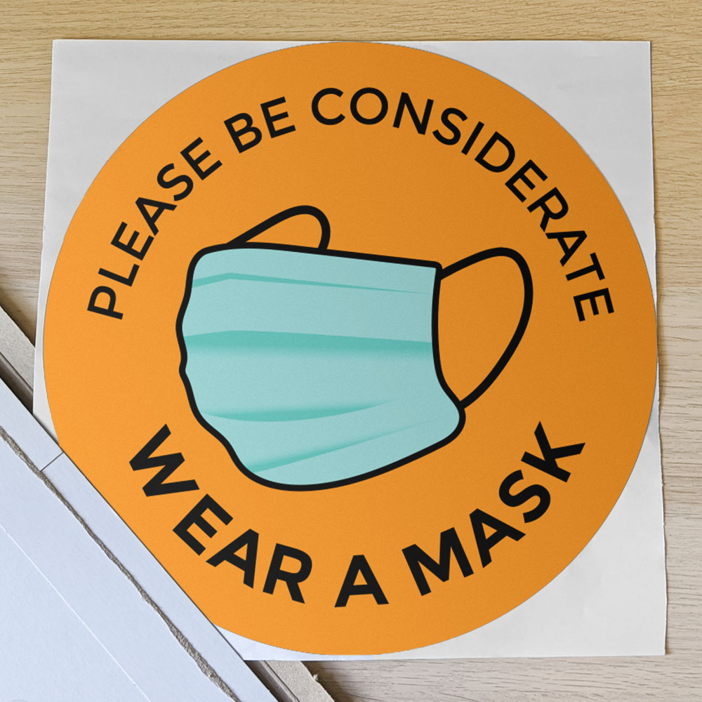 Orange "please be considerate, wear a mask" window/wall sticker in shipping envelope