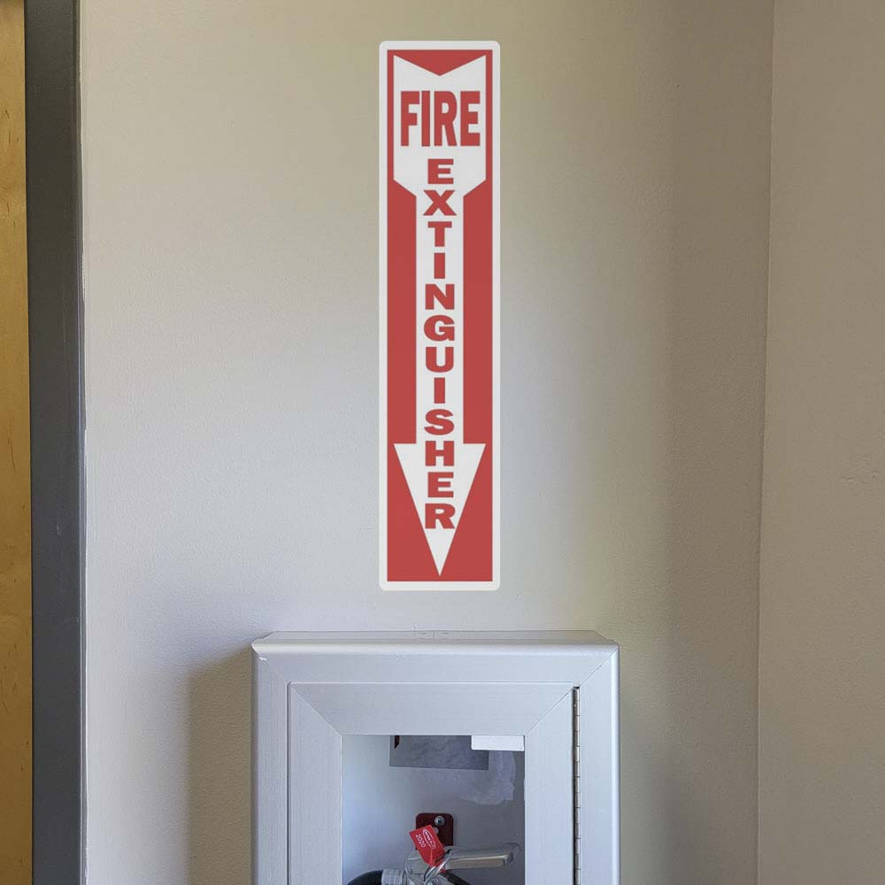 Fire extinguisher arrow safety sticker above fire extinguisher.