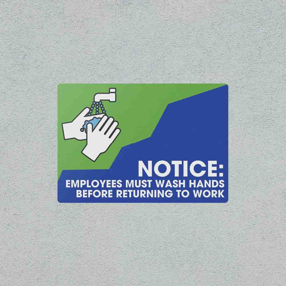 Employees Must Wash Hands safety sticker on a wall.