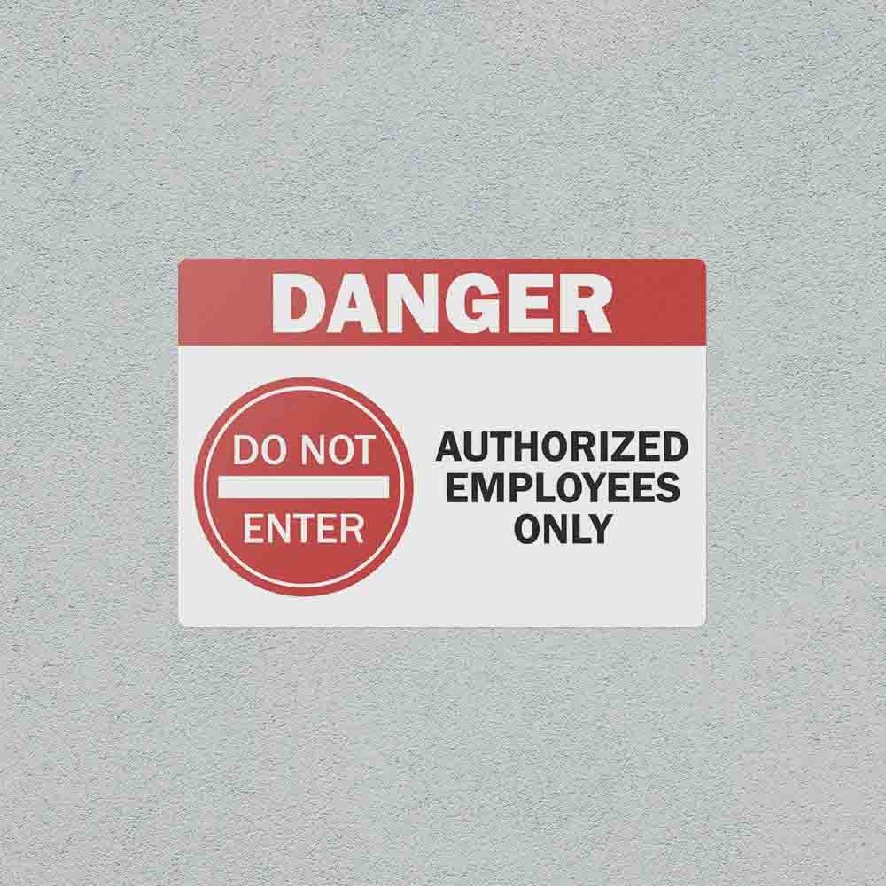 Authorized Employees Only safety sticker on a wall.