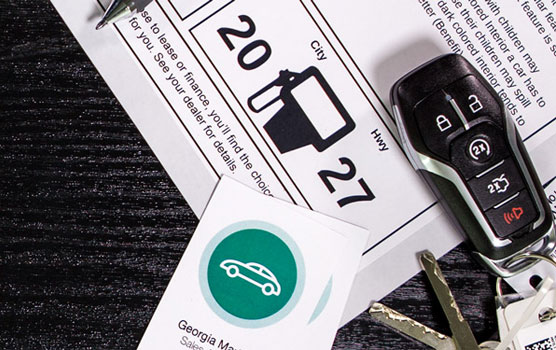 Lignin-free car dealer window stickers in use.